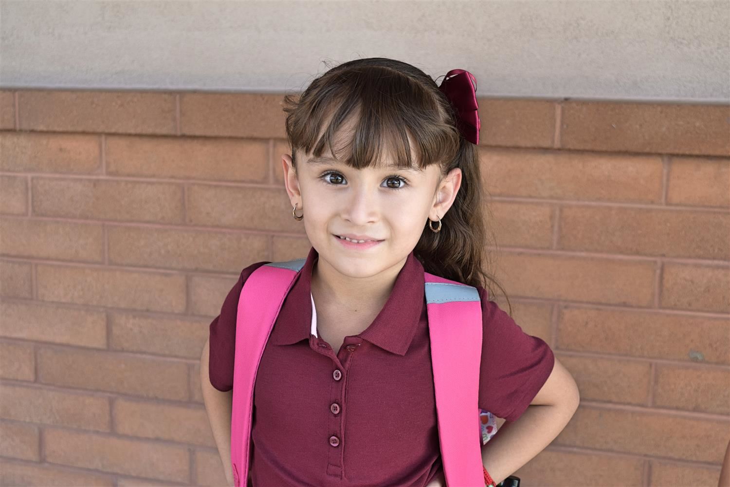 girl with pink backpack
